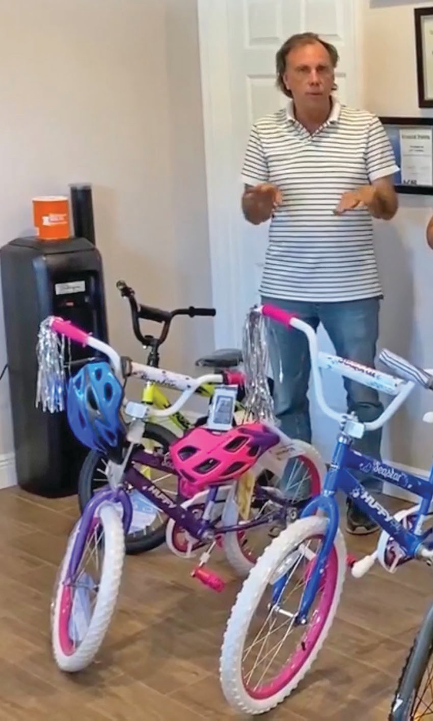 LABELLE — Jeff Campbell of Direct Repair Collision Center gives away two kids’ bikes for October as a way to show his appreciation for the community’s support.
